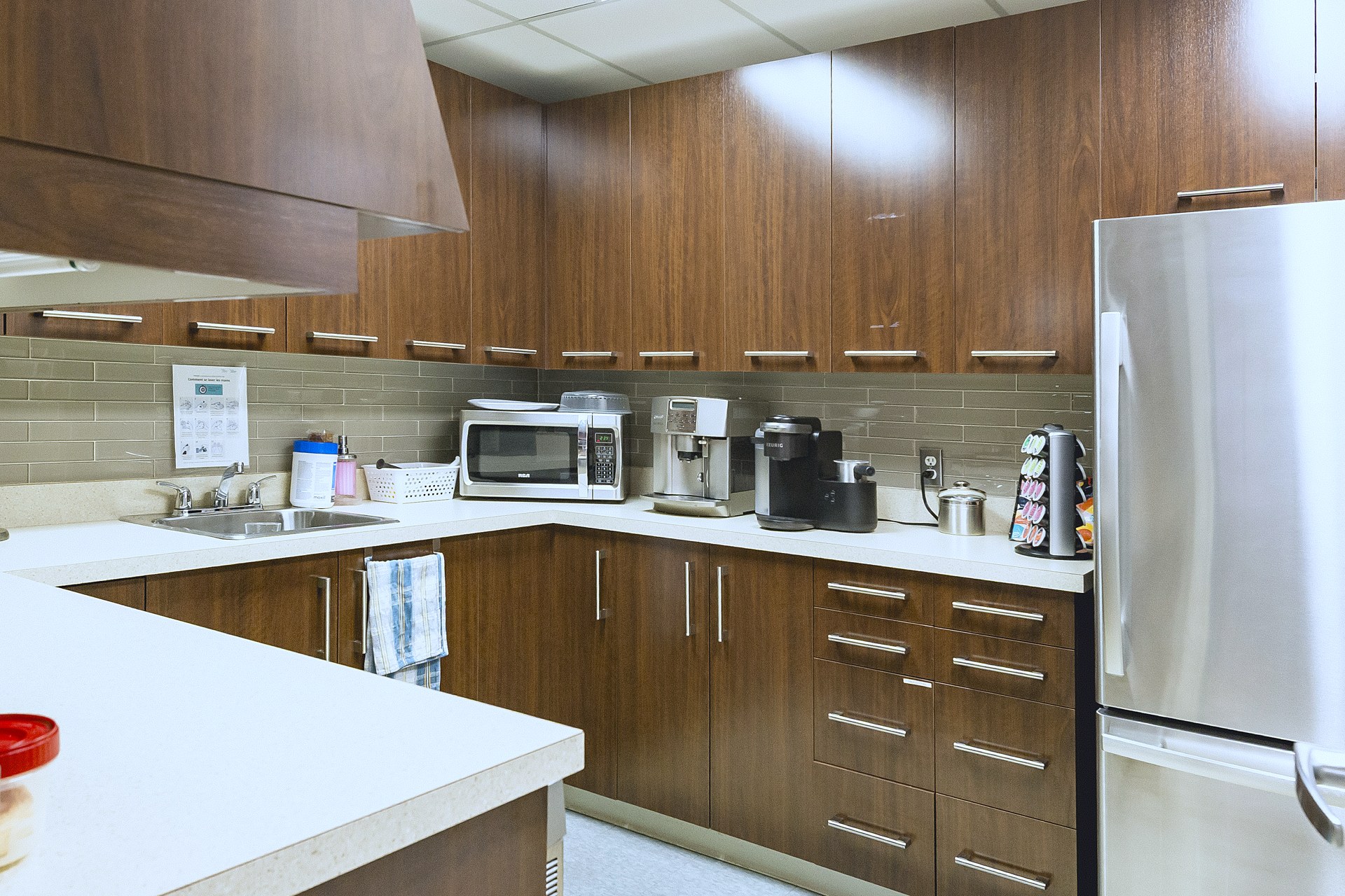 Functional kitchen with cabinets and full-size fridge